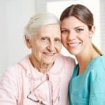 patient care technician posing with a patient