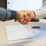 two people shaking hands