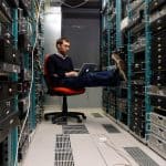 network engineer working on his laptop