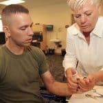 occupational therapist helping patient