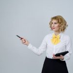 teacher assistant holding a folder