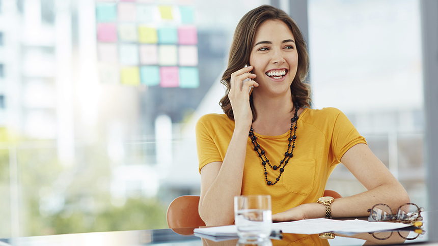 A young businesswoman talking on her cellphone about public relations