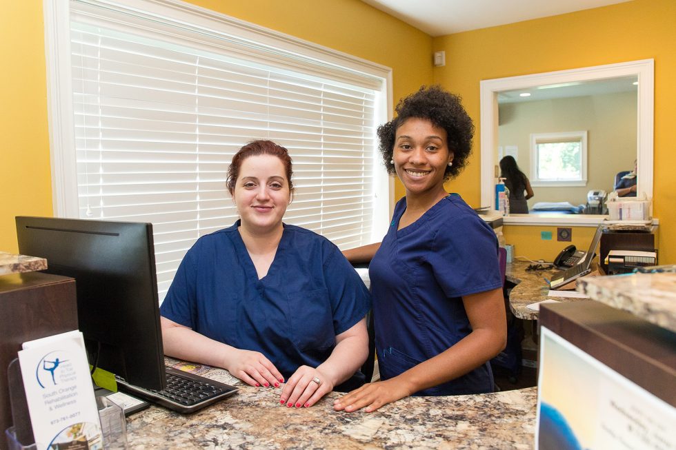 Chiropractic assistants in office waiting for the patients to appear.
 